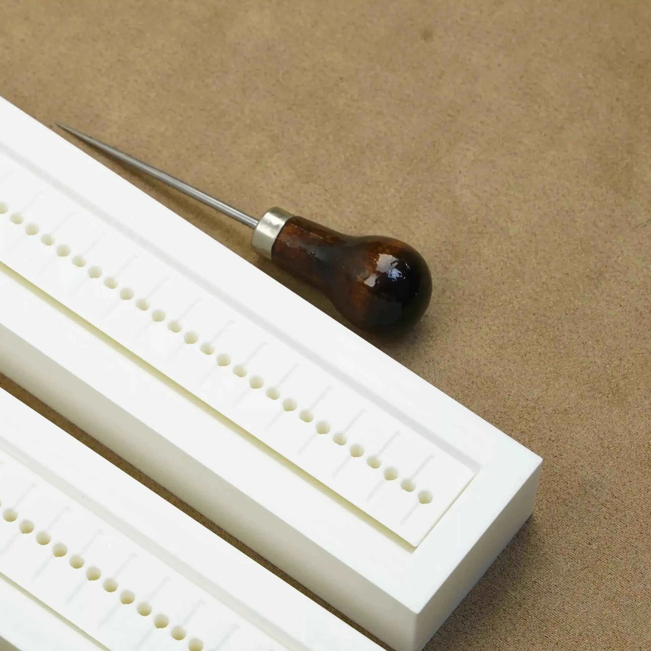 Bookbinding hole guide from The Create Studio for precise hole placement in bookbinding projects