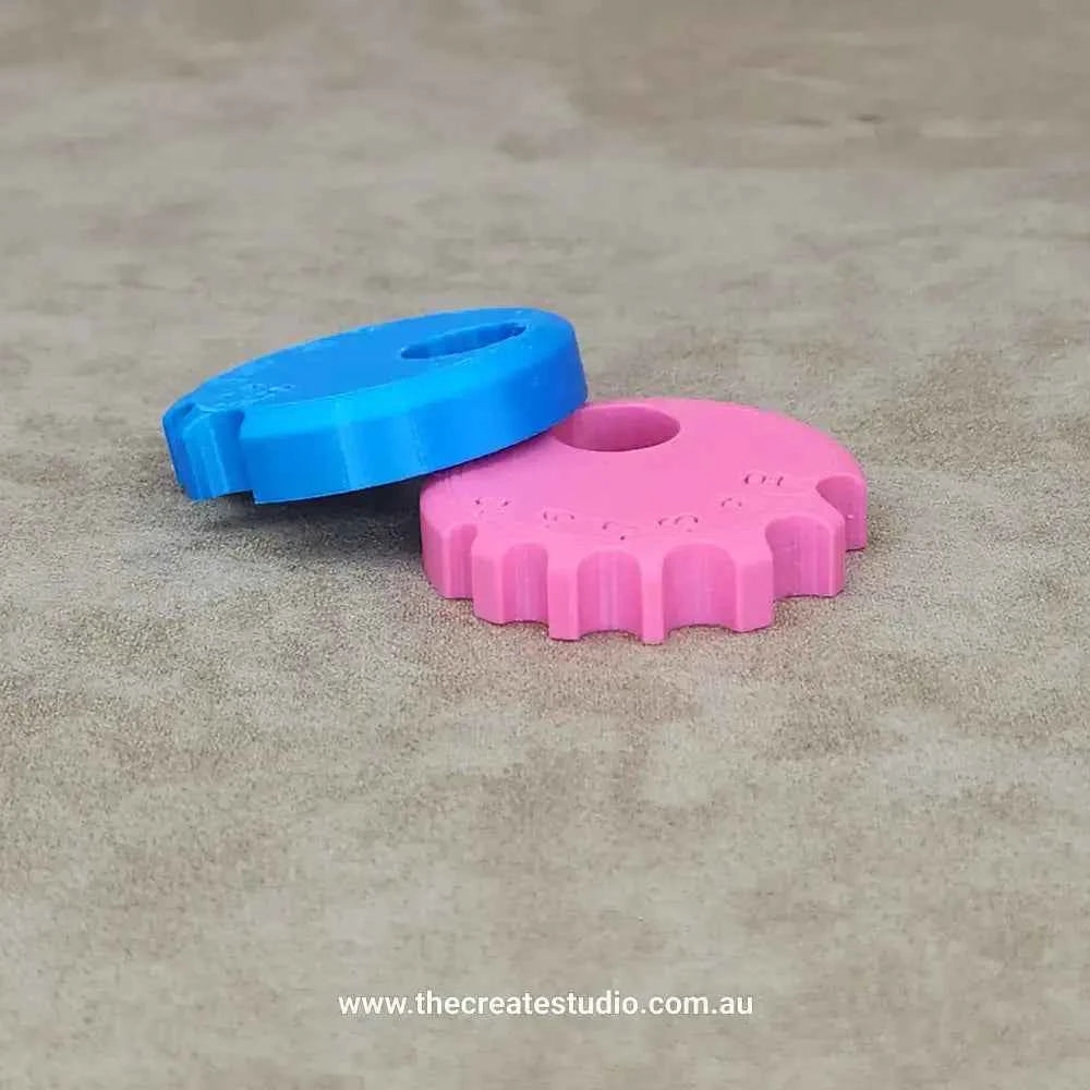 Round rib tool for ceramics in blue and pink for shaping and smoothing clay