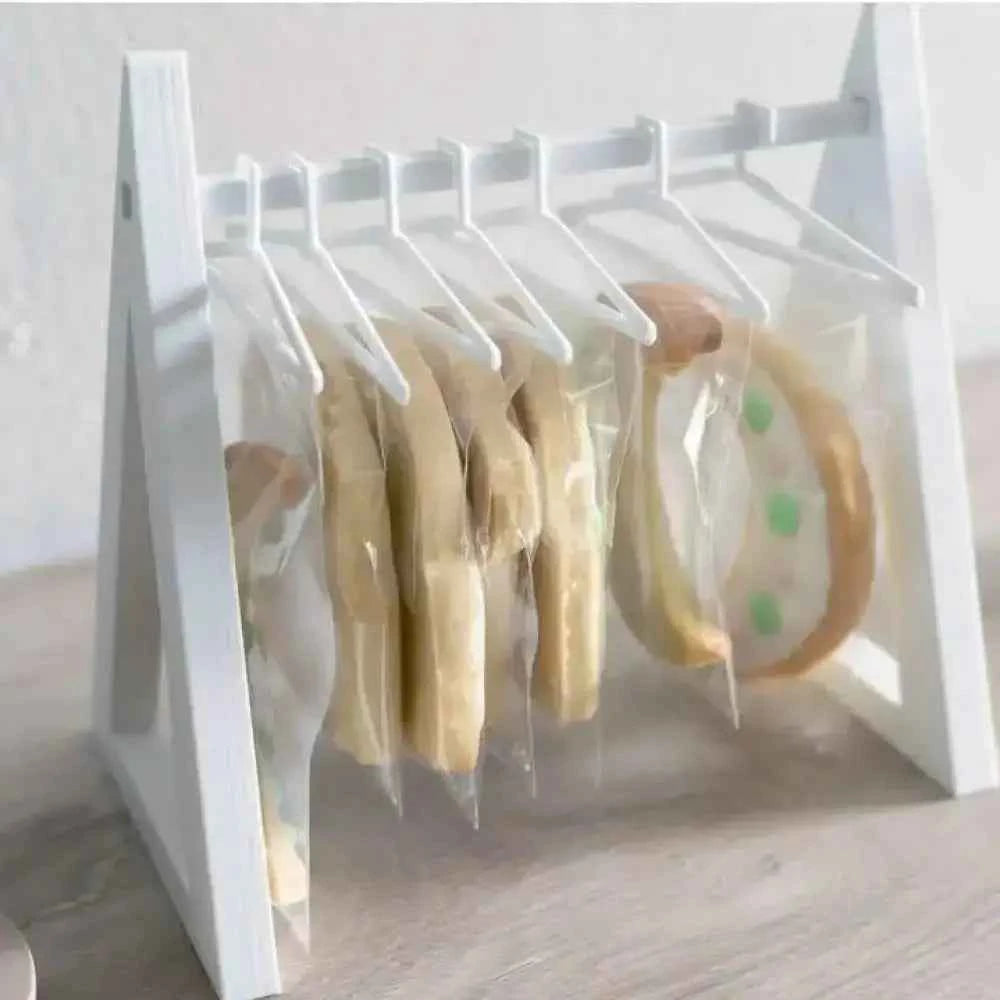 White countertop cookie display rack showcasing beautifully packaged cookies for an attractive presentation