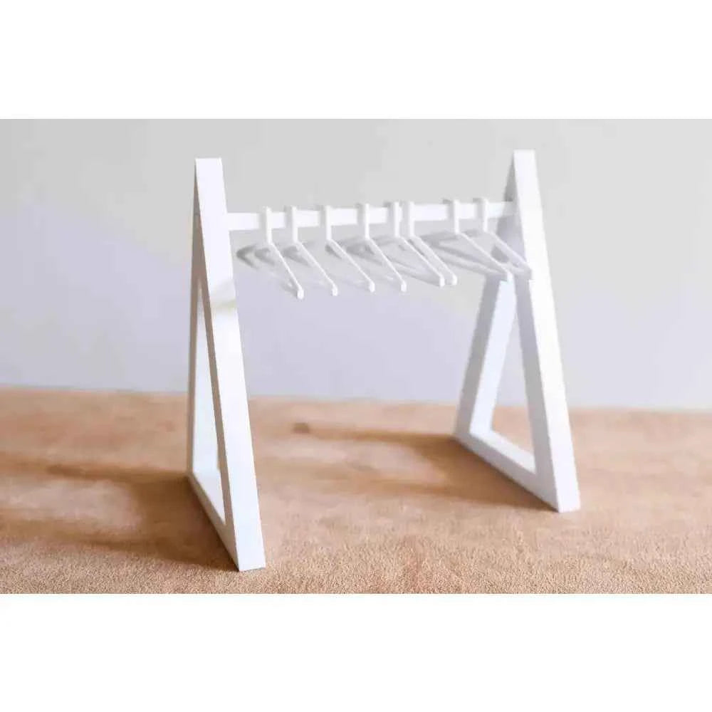 White countertop cookie display rack with six hooks for showcasing baked goods in a stylish way