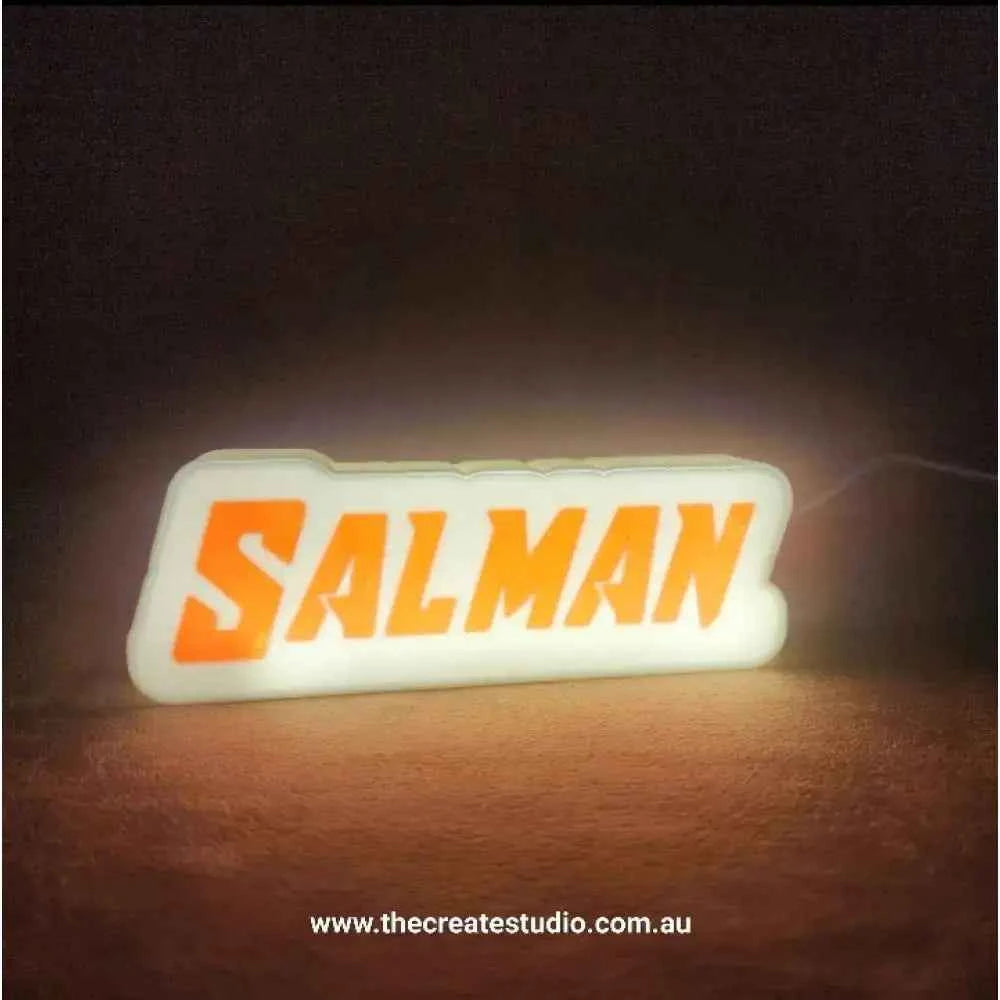 Custom gift light box featuring illuminated name 'Salman' in vibrant orange design