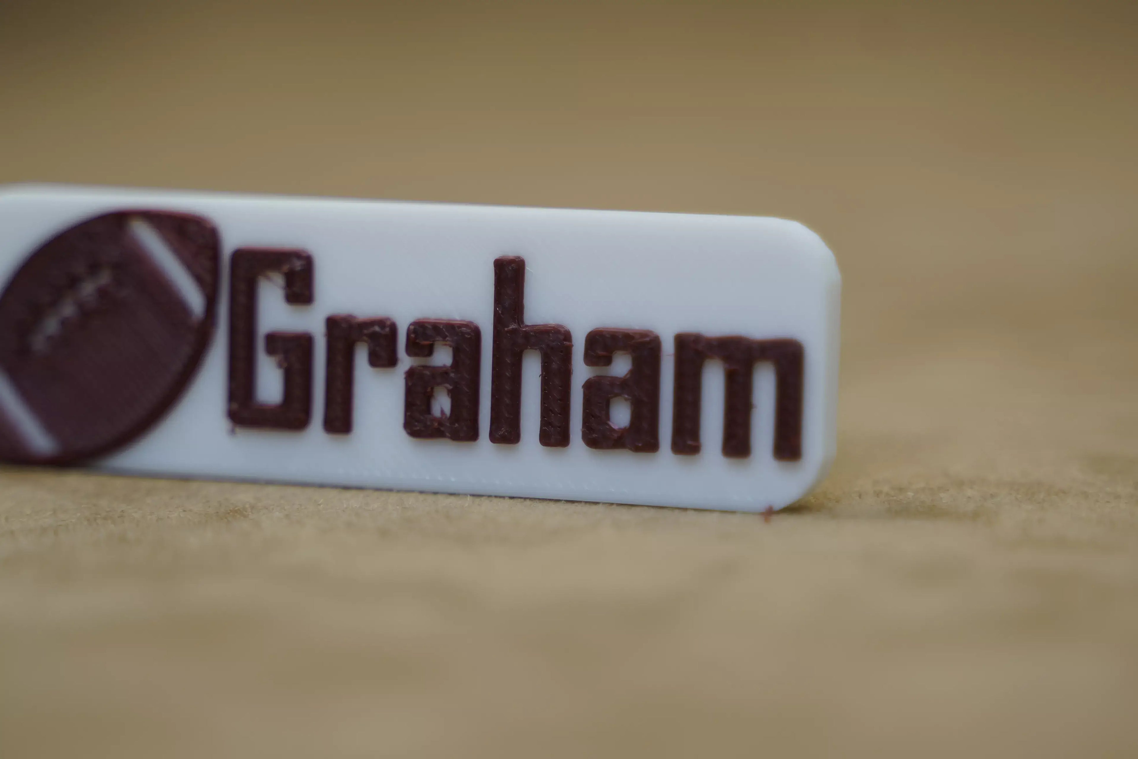 Custom name footy keyring with the name Graham and football design for personalised gifting