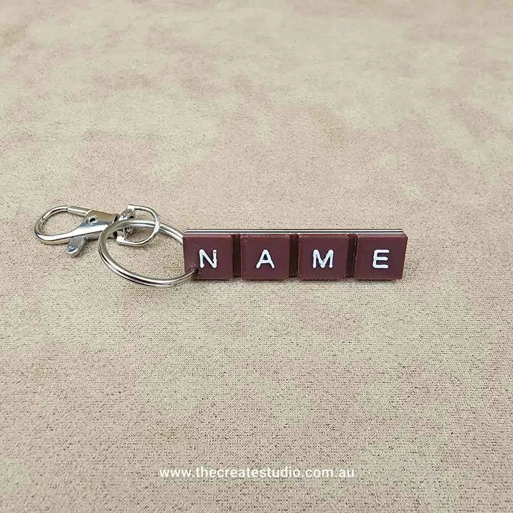 Personalised chocolate bar keychain featuring custom name blocks for a unique accessory