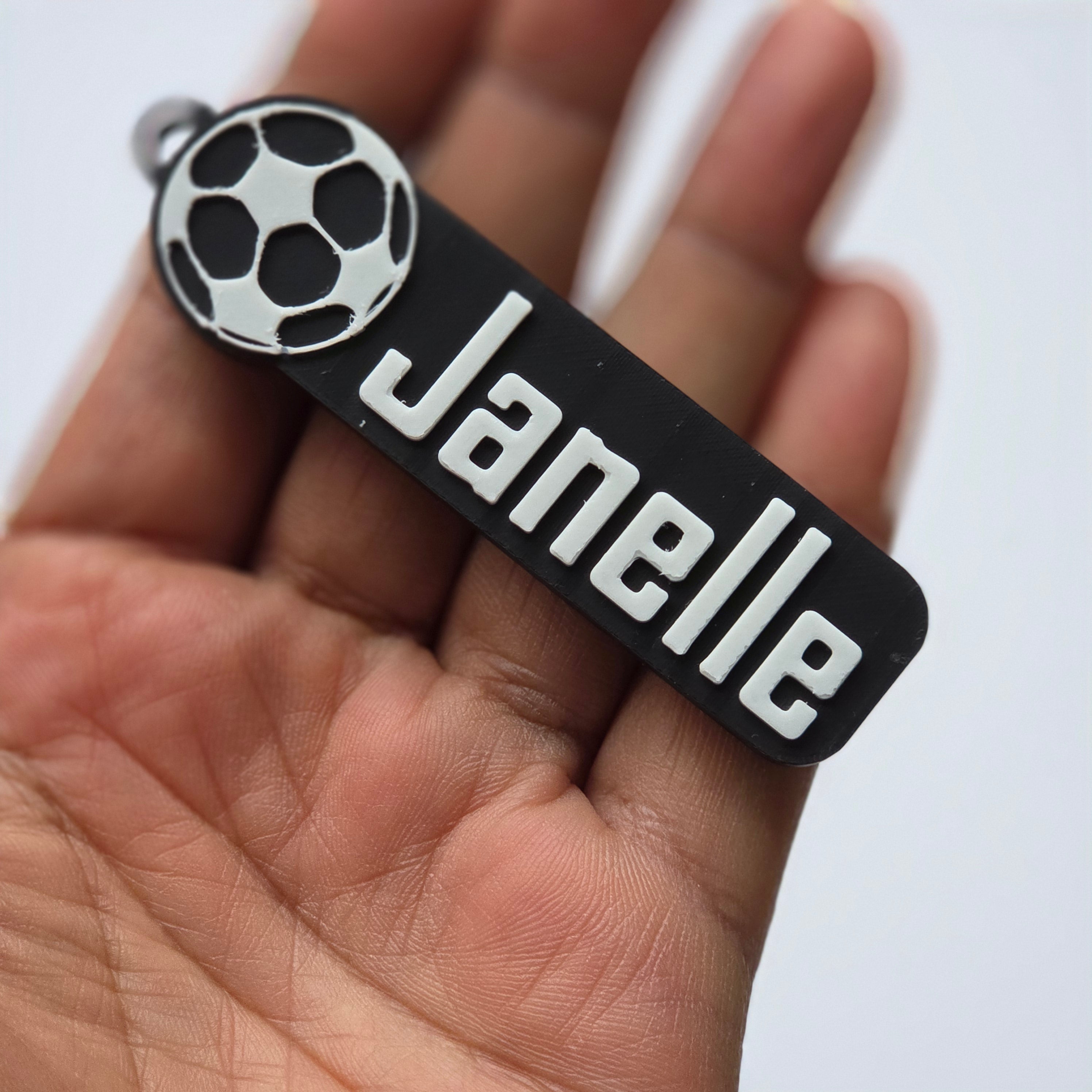 Personalised football keychain featuring a custom name in bold letters and a football design