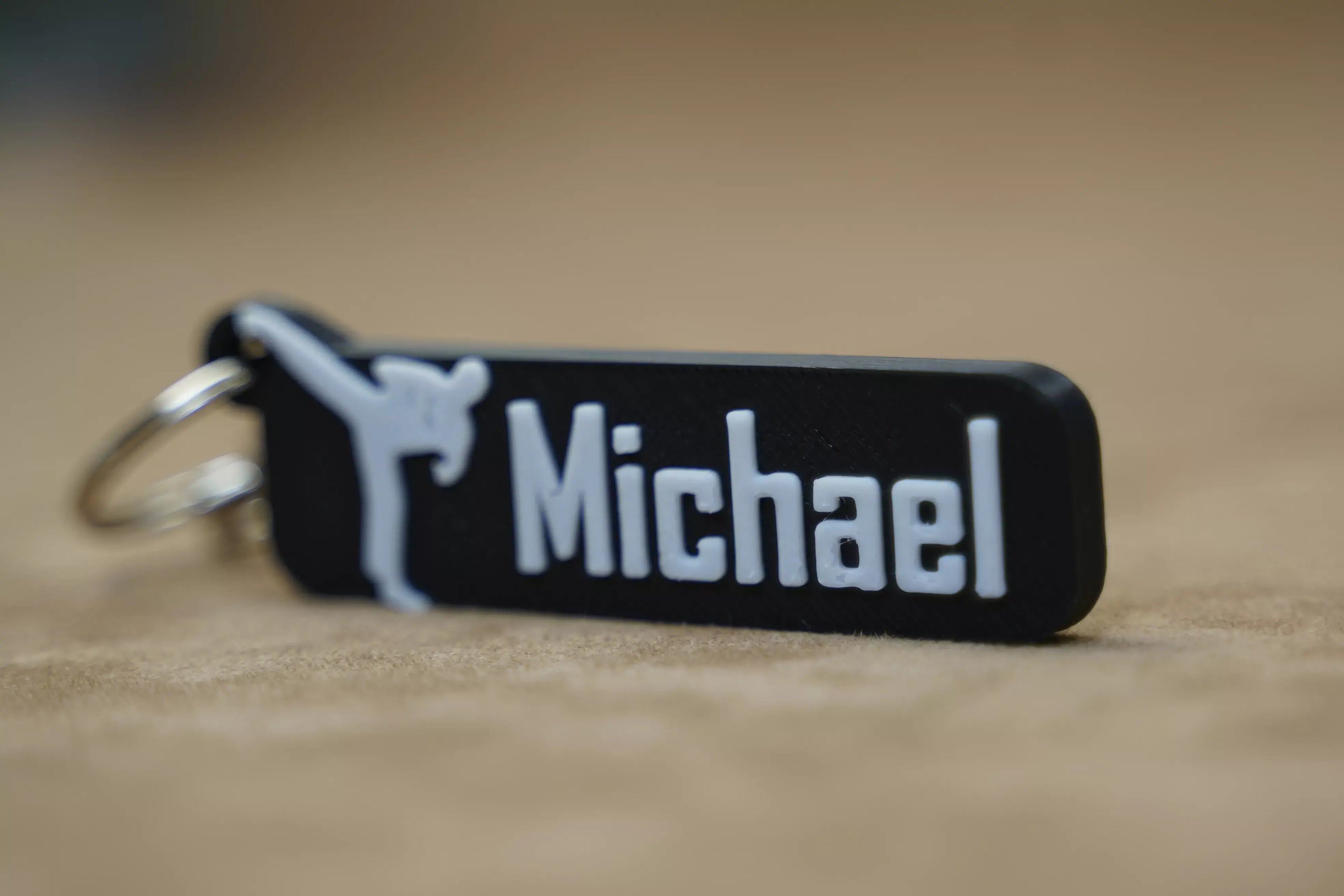 Personalised karate keychain in black with white lettering for a unique touch