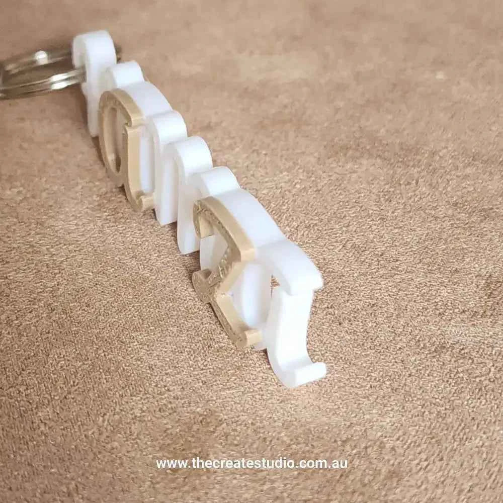 White personalised keychain with name featuring a stylish design and durable material