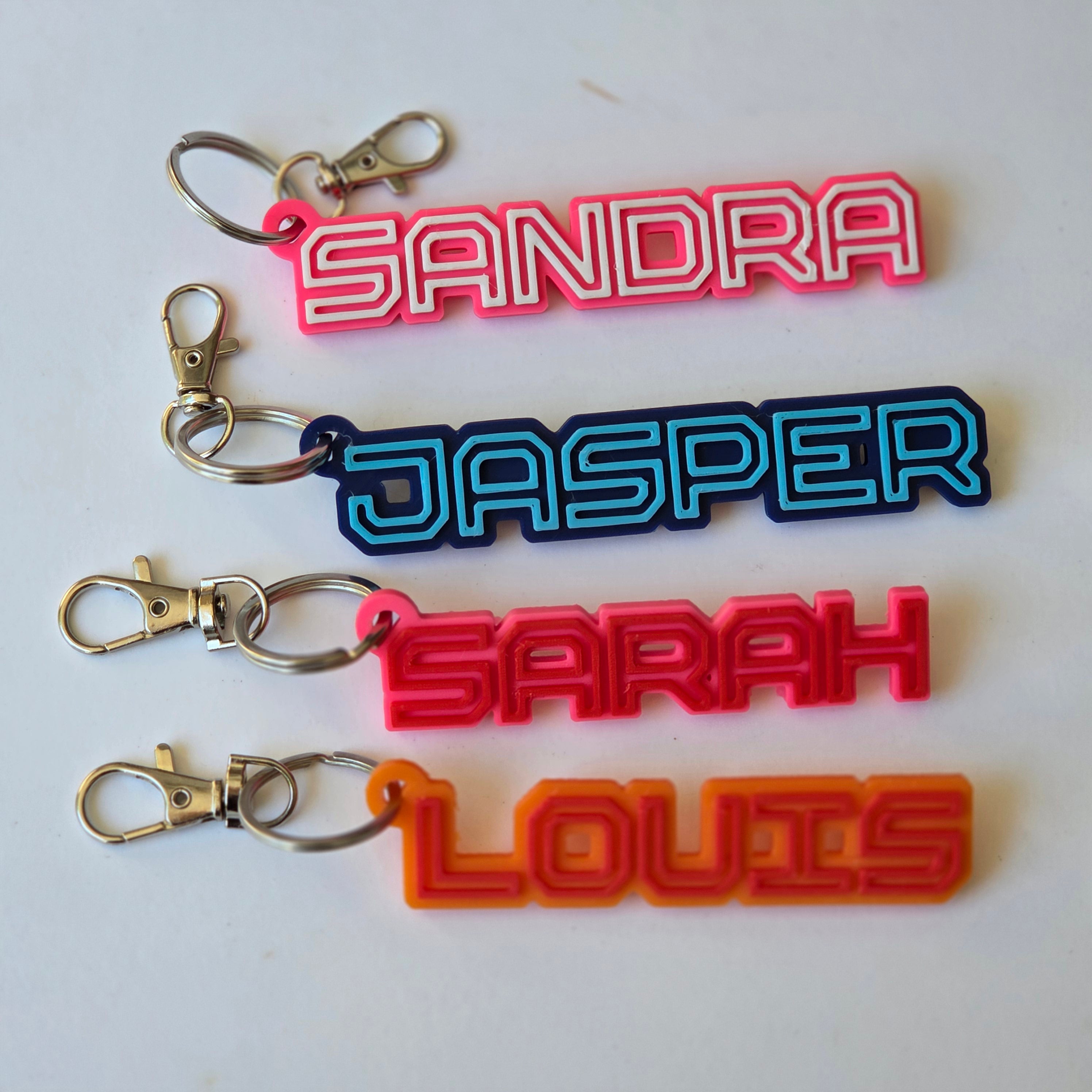 Personalised name keyring set featuring vibrant colours and unique names for stylish organisation