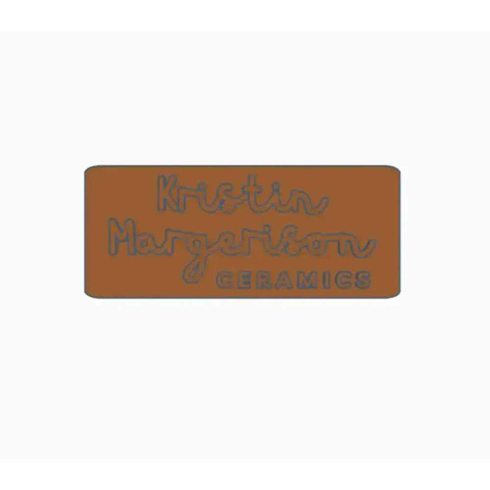 Personalised pottery stamp with engraved text for unique ceramic creations