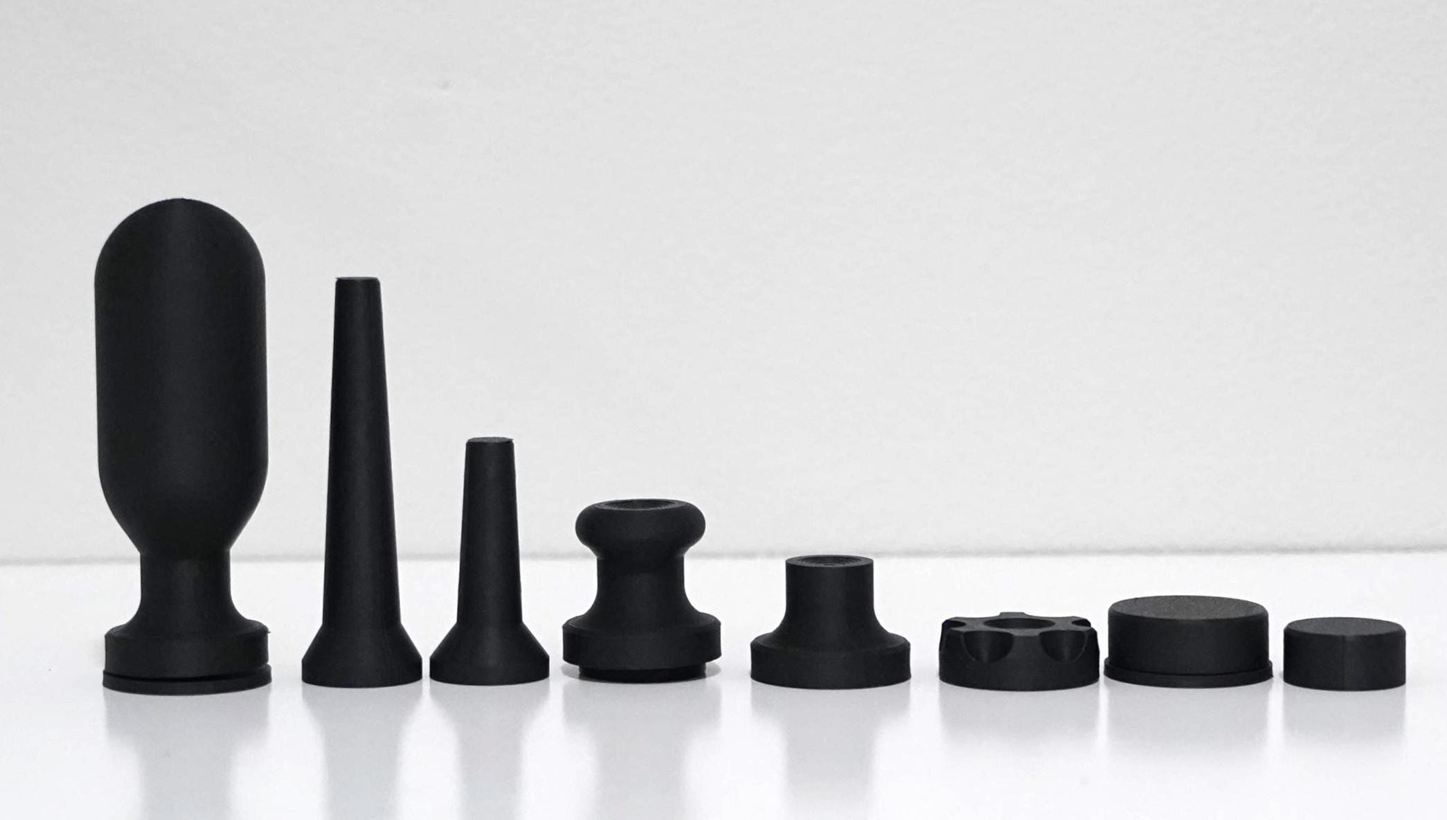 Assorted black pottery spinner tools for shaping and finishing pottery projects