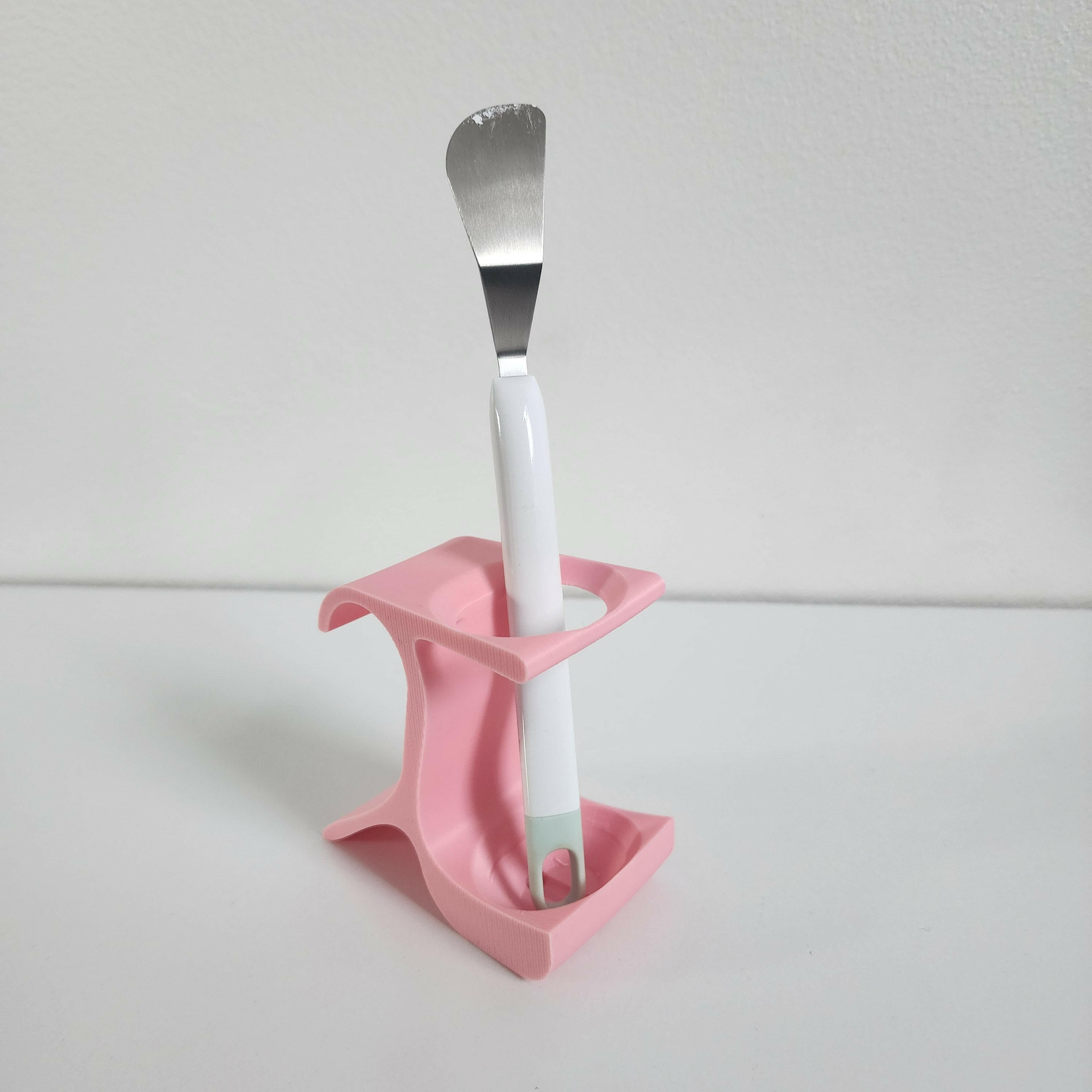 Pink pottery wheel tool holder with spatula for organizing pottery tools neatly