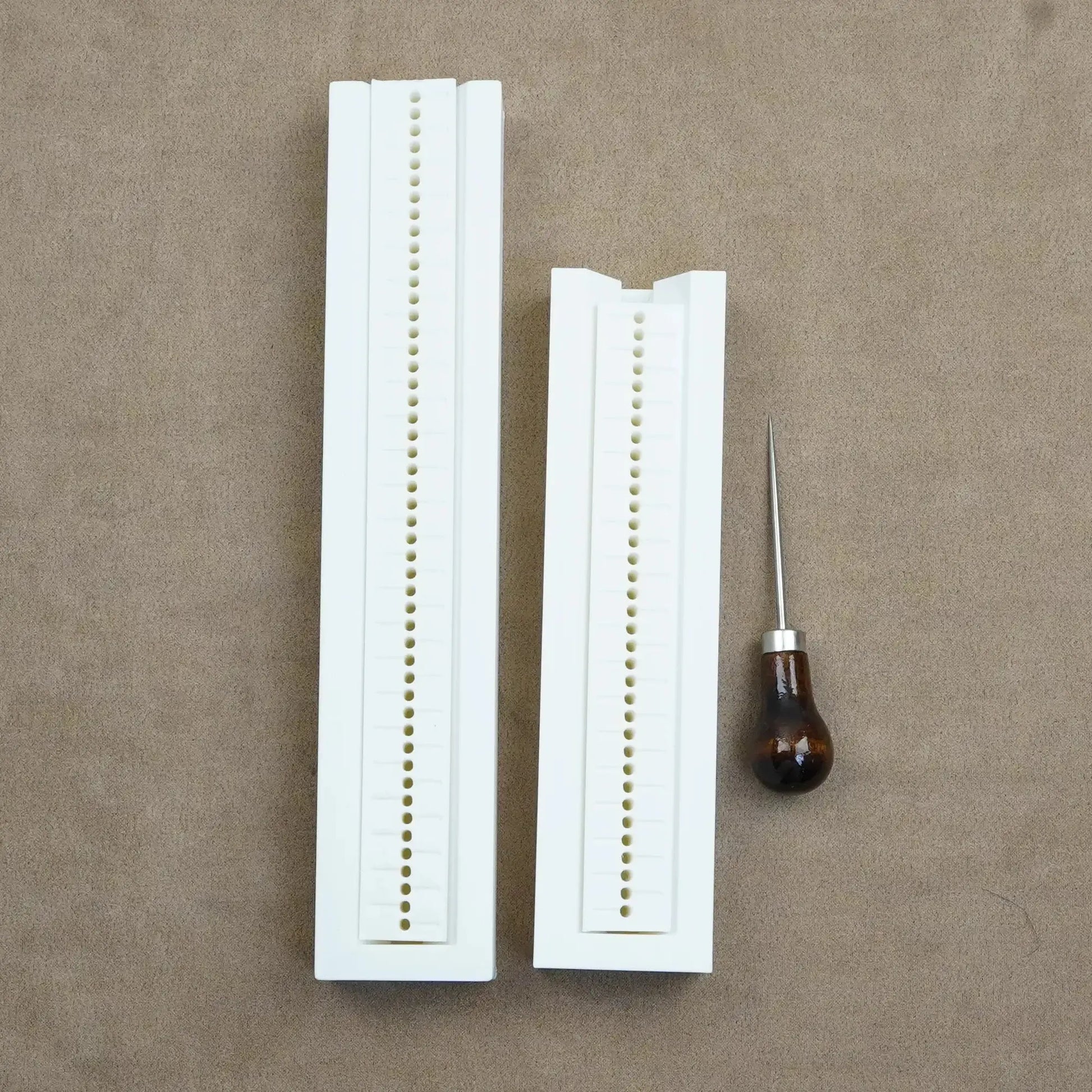 Hole punch guide and tools for custom bookbinding, journaling, and scrapbooking projects.
