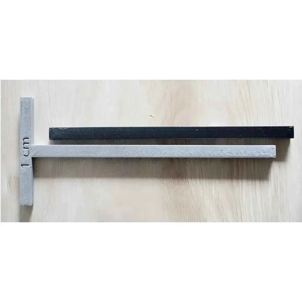 Complete bookbinding toolkit featuring a measuring tool with 1 cm markings in various colors