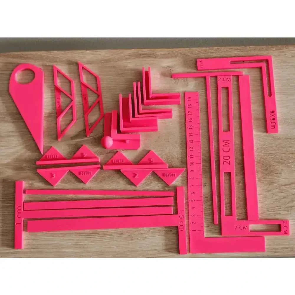 Complete bookbinding toolkit featuring various pink tools for precise bookbinding projects