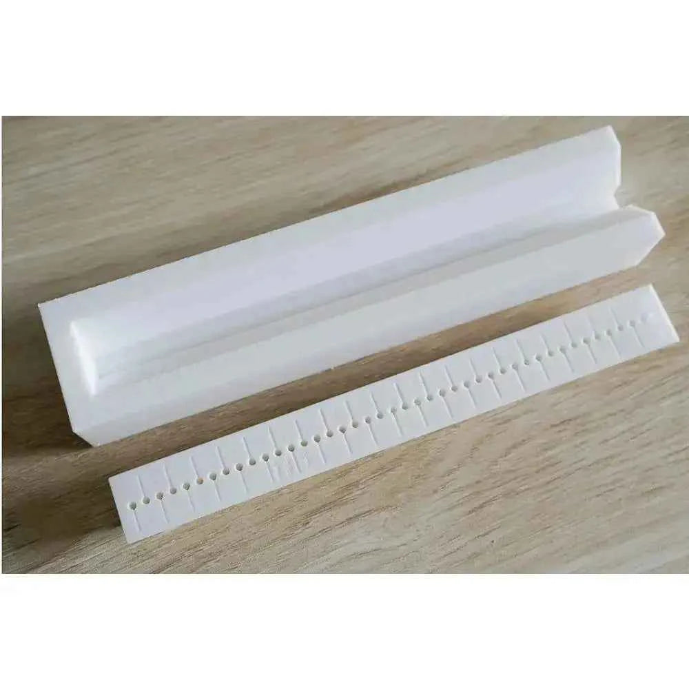 Complete bookbinding toolkit including a bone folder and stitching guide for precise binding