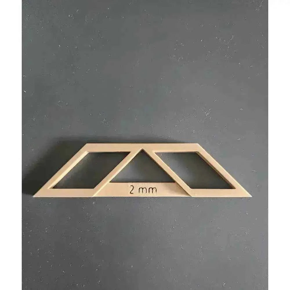 Wooden bookbinding tools set featuring a 2 mm thickness guide for precise paper alignment