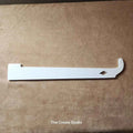 White plastic bee hive J hook tool from The Create Studio for lifting frames and separating hive parts