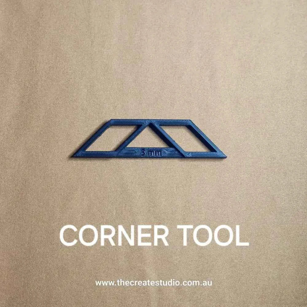 Book binding corner tool in blue for precise book corner rounding and crafting