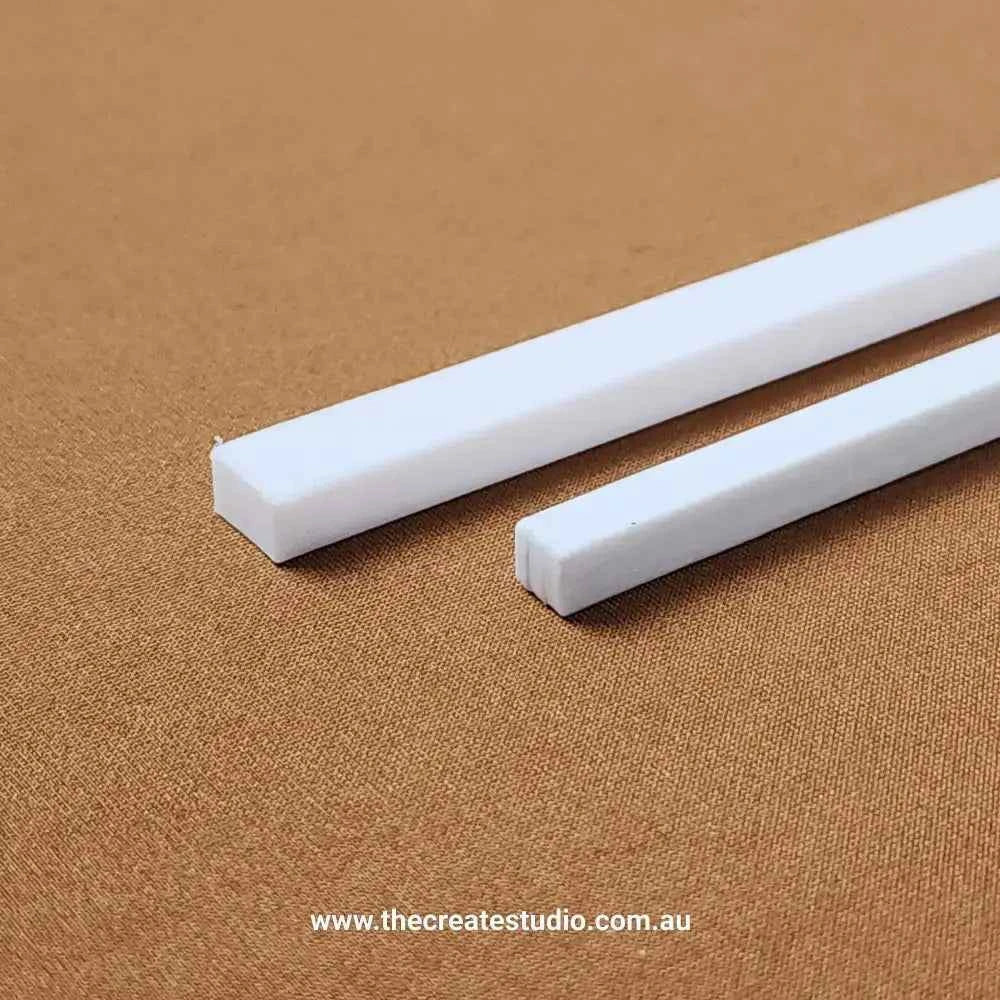 The Create Studio book binding set featuring two white binding strips for various book projects