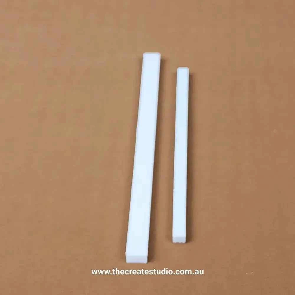 White book binding set tools including two flat strips for perfect book assembly