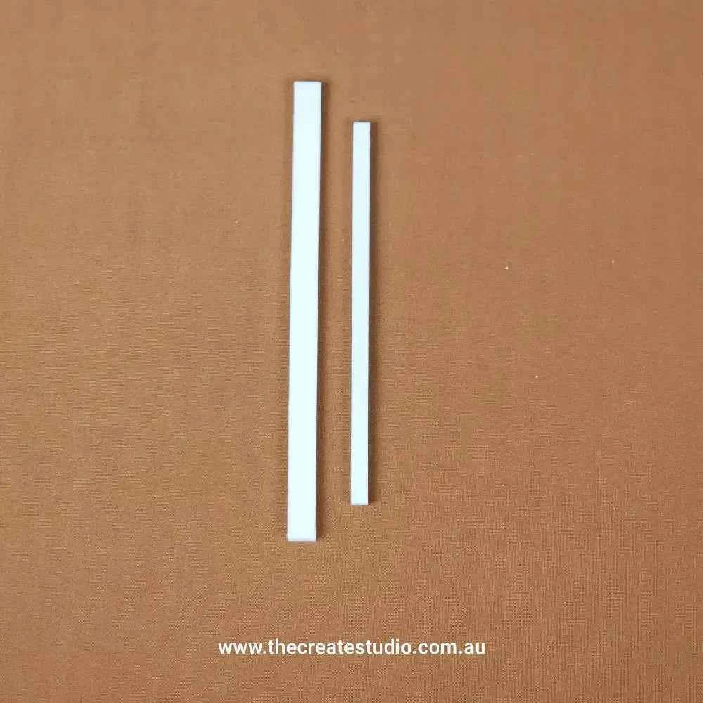 White book binding set including two different size strips for various bookbinding projects