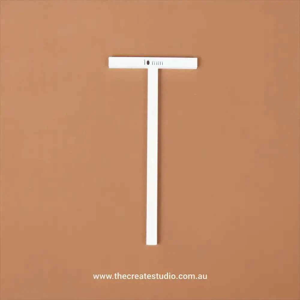 T-piece binding accessory in white, ideal for precise crafting and design projects