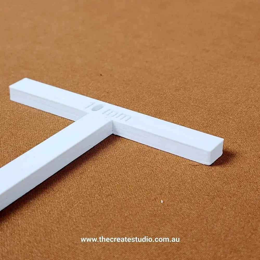 T-piece binding accessory in white for precise binding tasks and easy handling