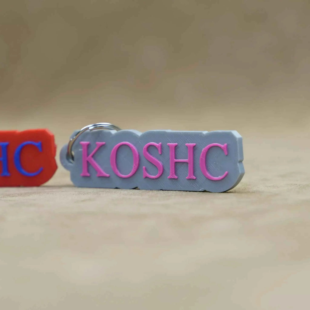 Custom font keychains in red and blue with personalised text for unique gifting options