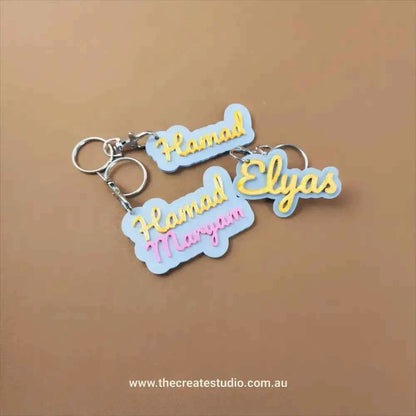 Custom name keychain in colorful designs featuring the names Hamad and Elyas from The Create Studio