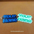 Custom pixelated name keychain in blue and green with personalised text for an original accessory