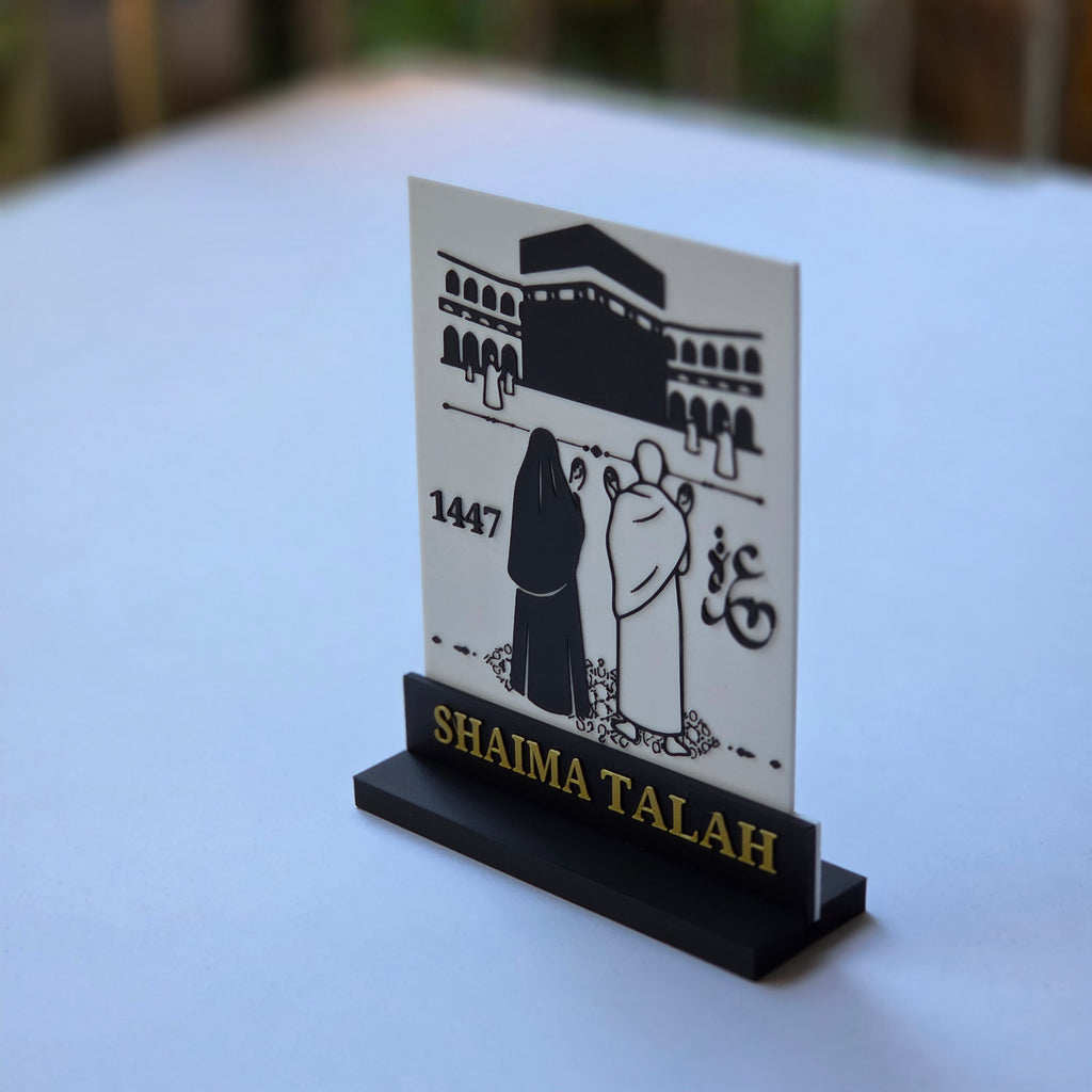 Custom Umrah keepsake plaque featuring Islamic calligraphy and a design of pilgrims near the Kaaba