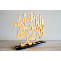 Stylish Islamic calligraphy table decor in gold with intricate designs and a sturdy black base