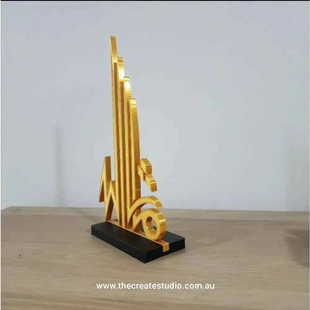 Stylish Islamic calligraphy tabletop art in gold design on a black base for elegant home decor