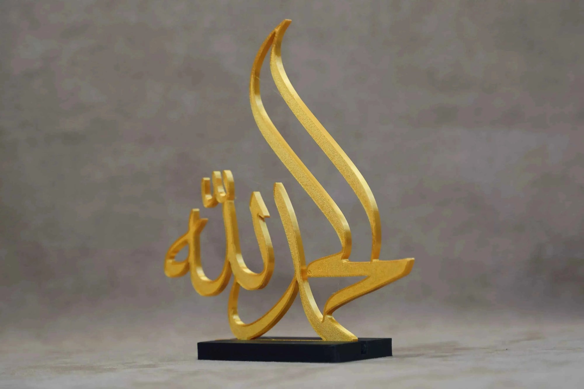 Golden Islamic Calligraphy Art Piece on Black Base for Elegant Islamic Table Decor