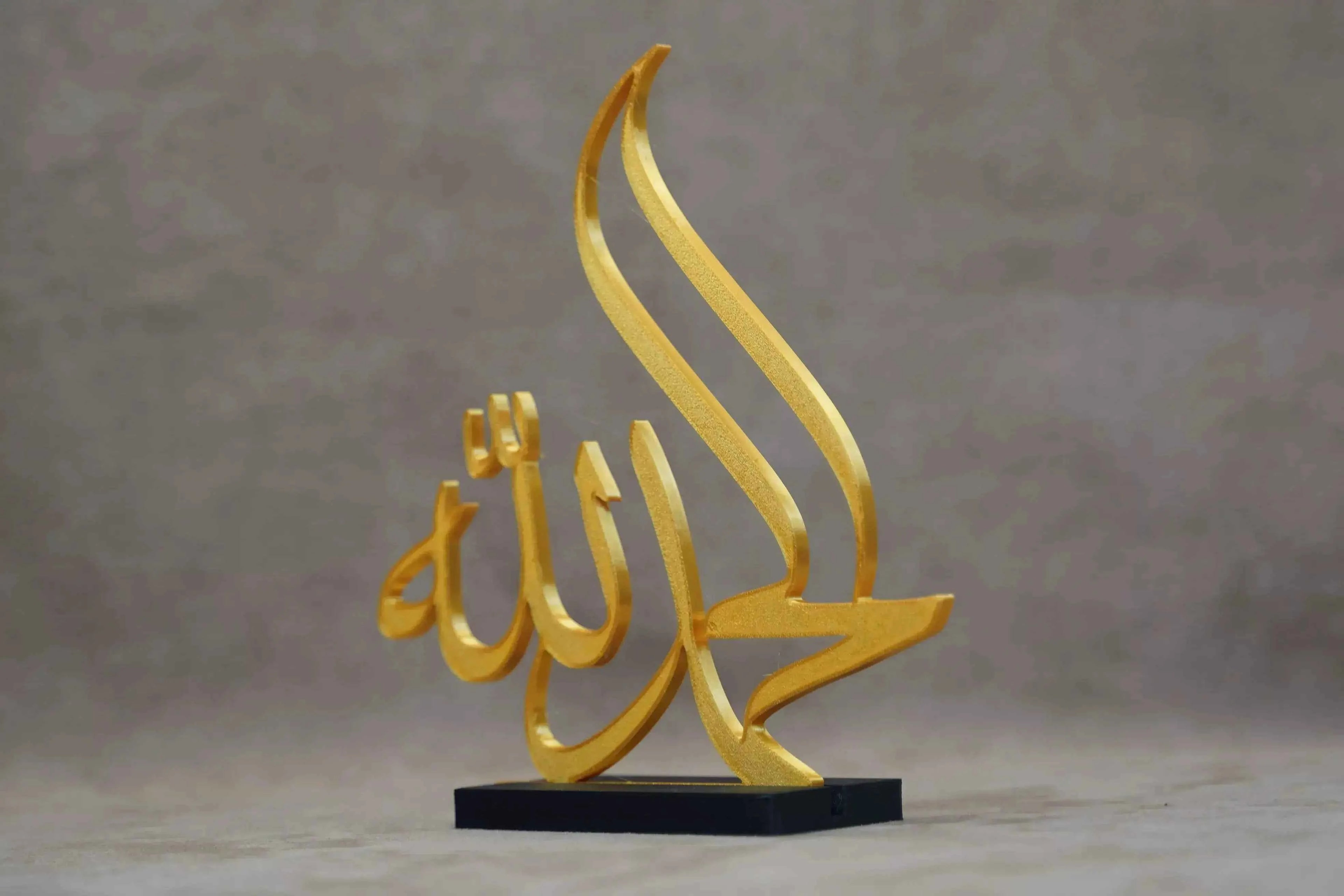 Golden Islamic Calligraphy Art Piece on Black Base for Elegant Islamic Table Decor