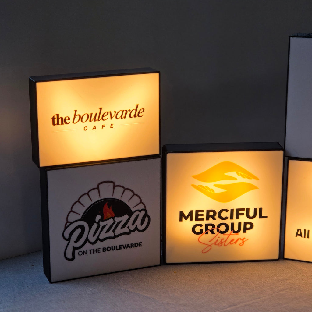 Stacked illuminated branded box signs with cafe and pizza logos unique corporate desk light box for office decor