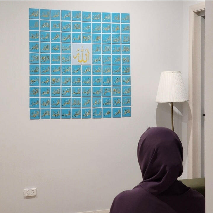 99 Names of Allah wall art by The Create Studio displayed on white wall in modern living room