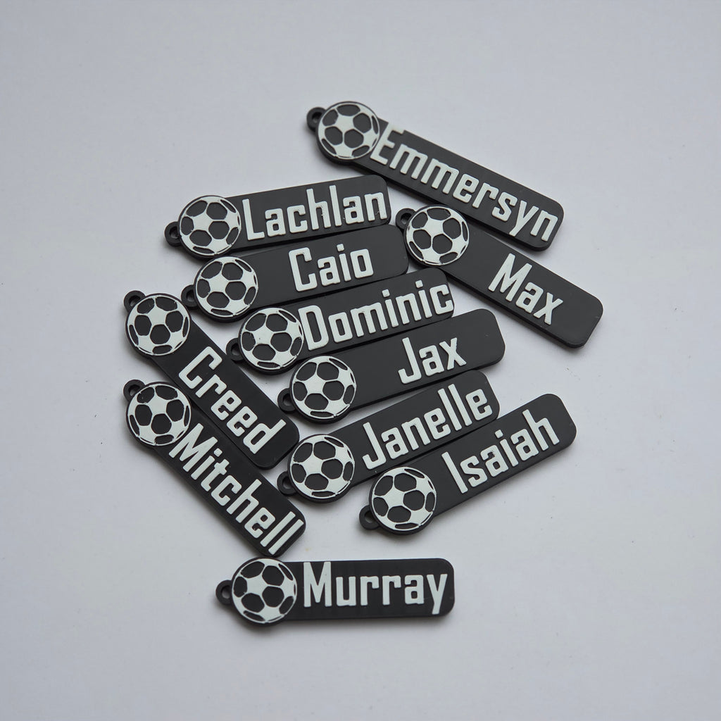 Personalised football keychain with various names in a stylish football design