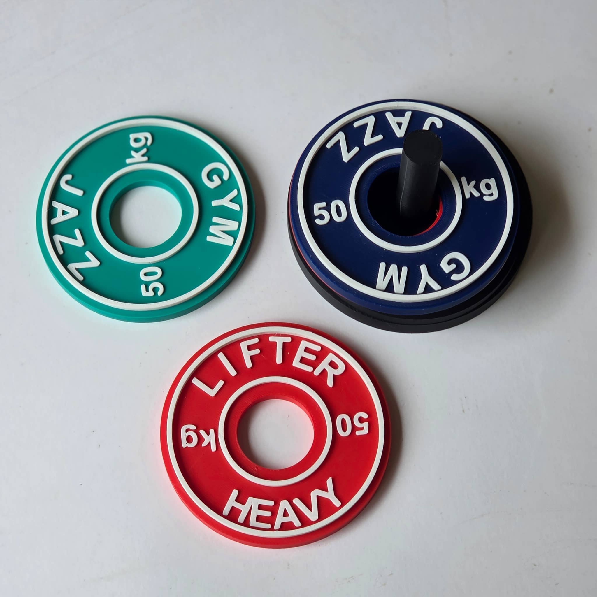 Personalised gym coasters set featuring colourful weight plate designs for fitness enthusiasts