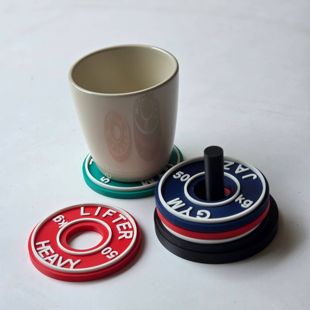 Set of personalised gym coasters shaped like weights, perfect for fitness enthusiasts