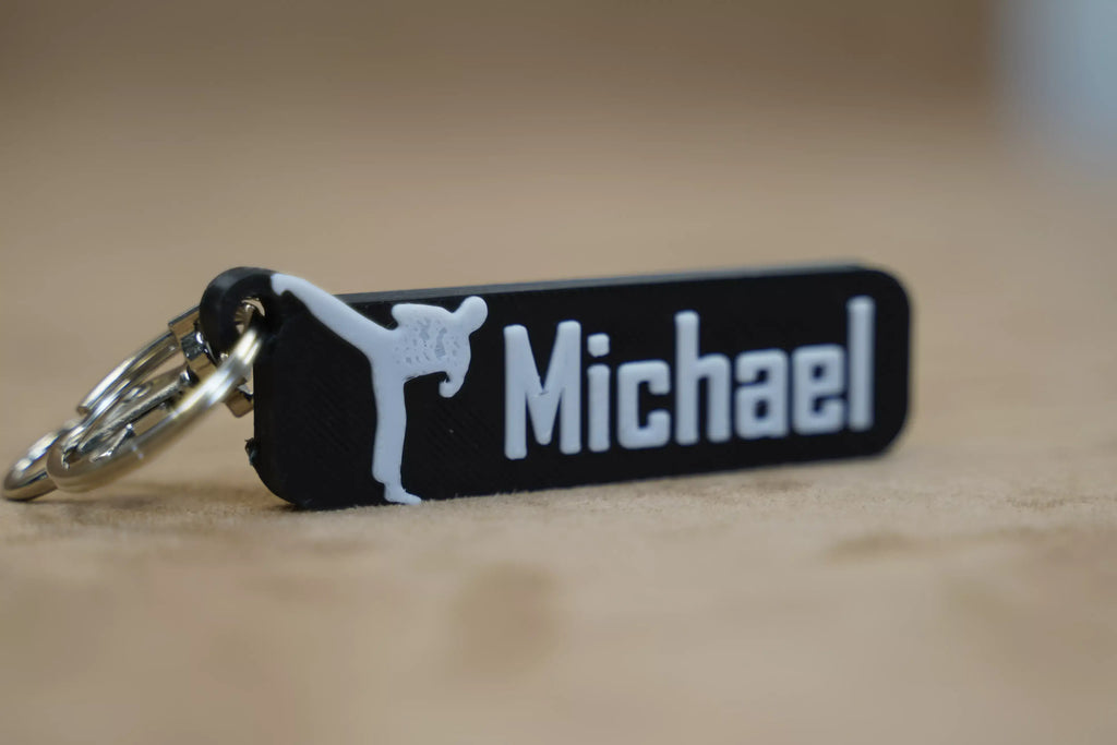 Personalised karate keychain featuring the name Michael with a martial arts design