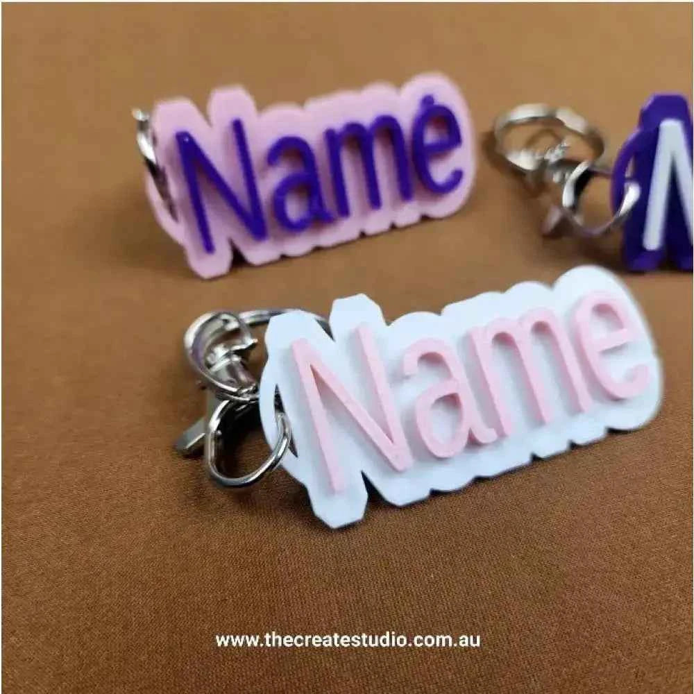 Personalised name keychain in pastel colours with a silver keyring attachment