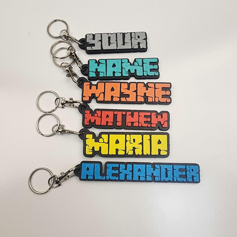 Colorful personalised name keychains displayed in various names for custom accessory lovers