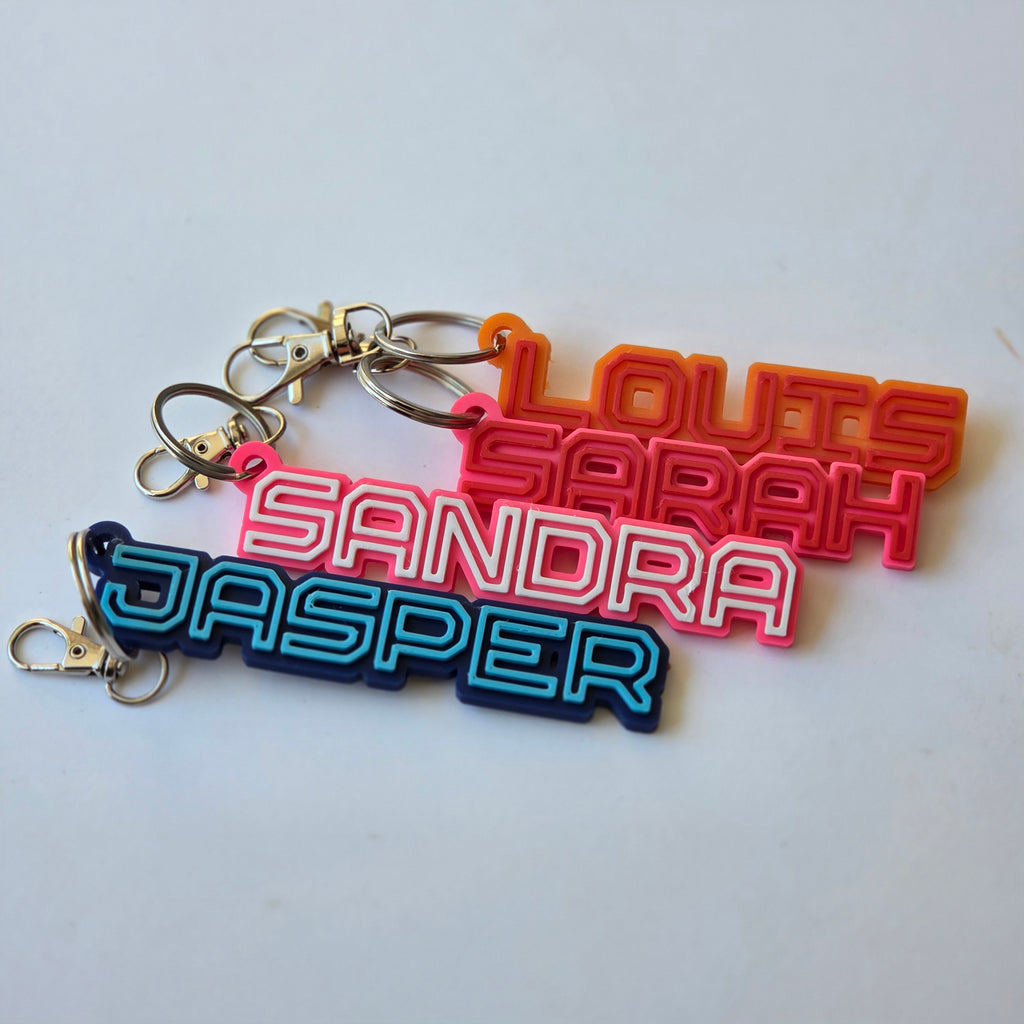 Personalised name keyring collection featuring vibrant colours and unique names for custom gifts