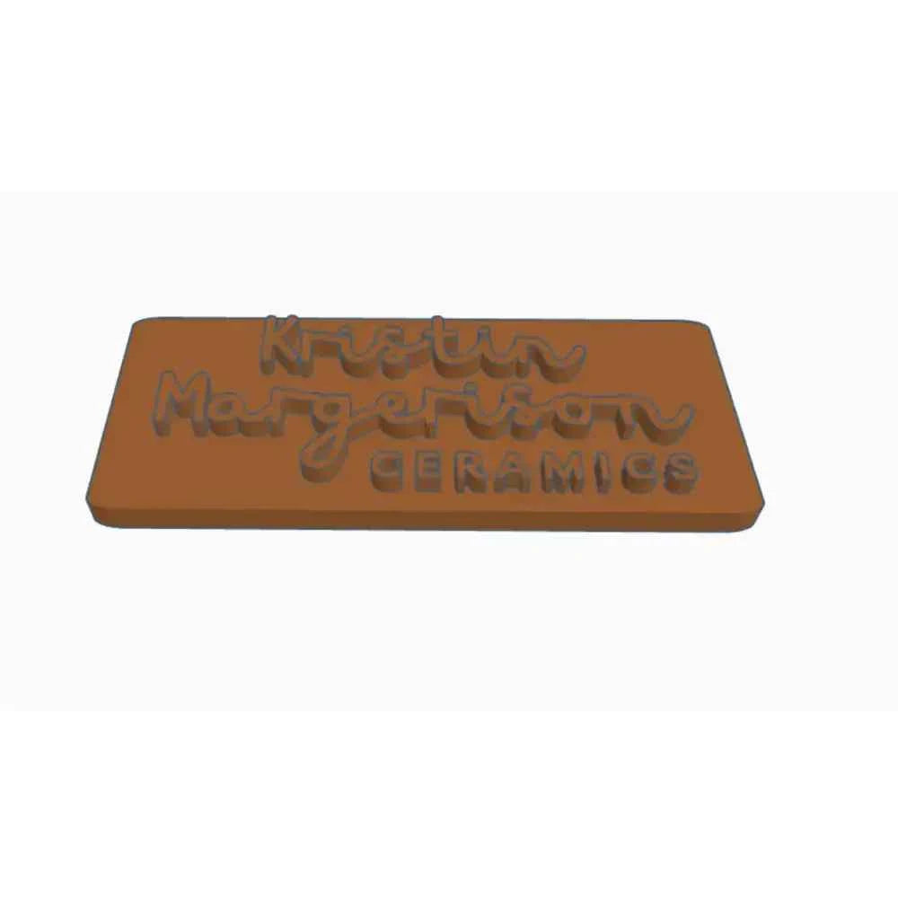 Personalised pottery stamp featuring the name Kristin Margerison and the word Ceramics