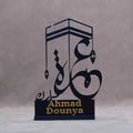 Personalised Umrah gifts featuring elegant Islamic calligraphy design with a Kaaba silhouette
