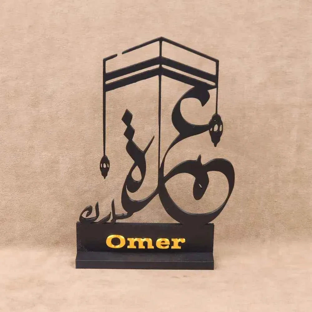 Personalised Umrah gifts featuring elegant Islamic calligraphy design with the name Omer