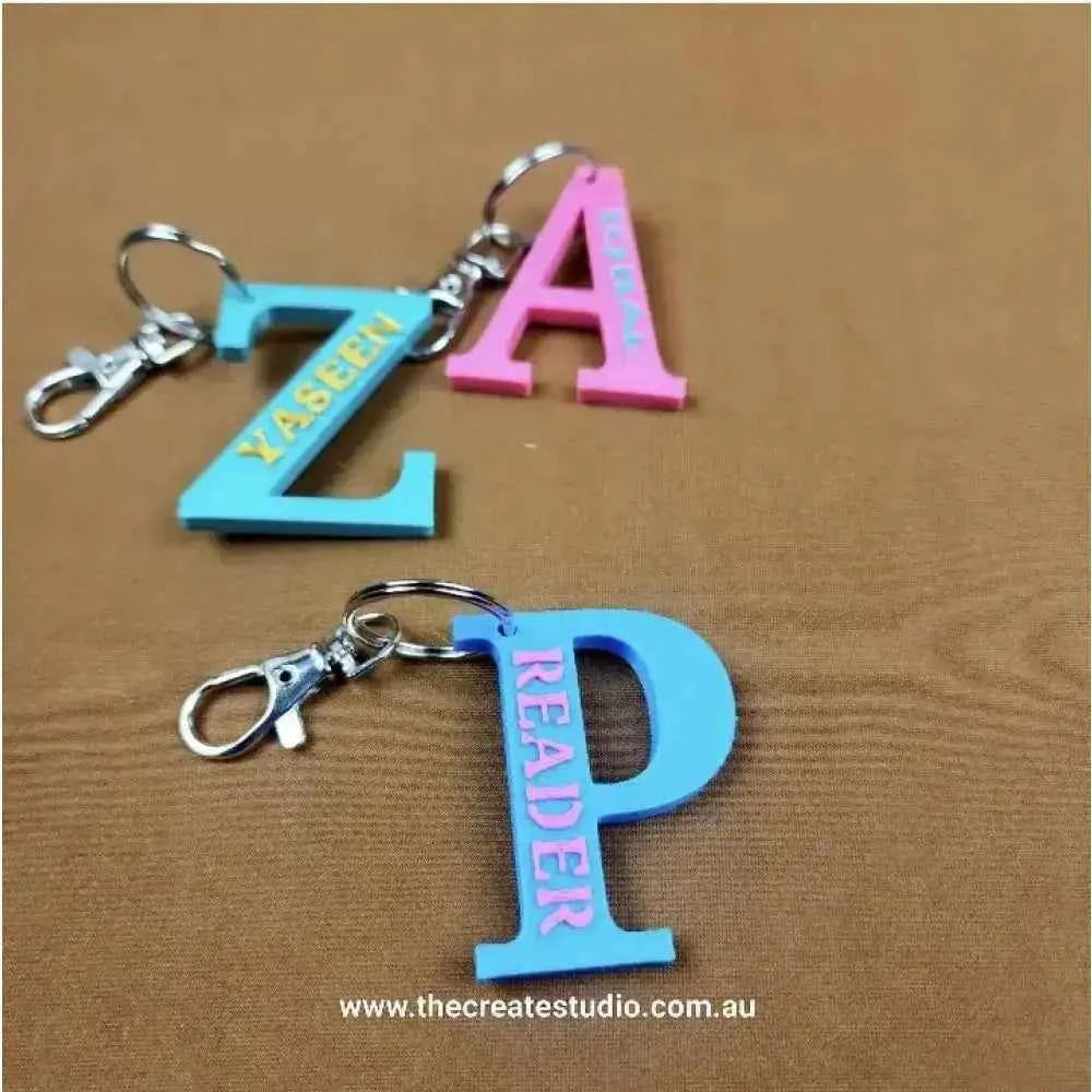 Personalized initial keychain in blue and pink featuring letters Z and P from The Create Studio