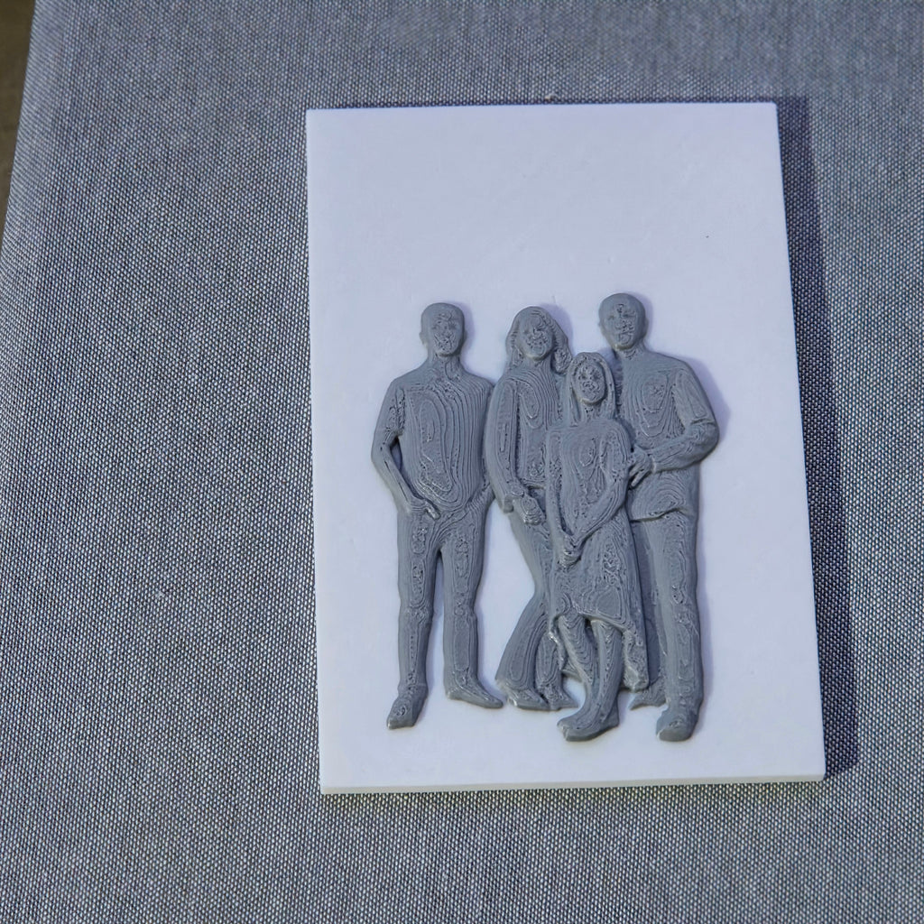 The Create Studio personalised custom photo sculpture art of a four person family grey 3D relief on white plaque