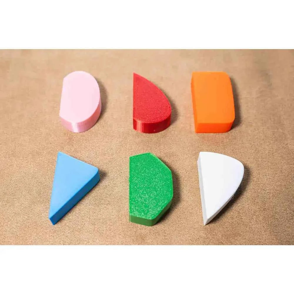 Colorful pottery mug handle molds in various shapes for crafting unique ceramic handles