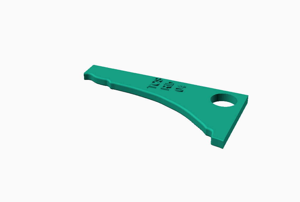 Green pottery rib tool with a curved edge for shaping and smoothing clay surfaces